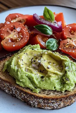 Geröstetes Brot mit Avocadobutter und Tomatensalat
